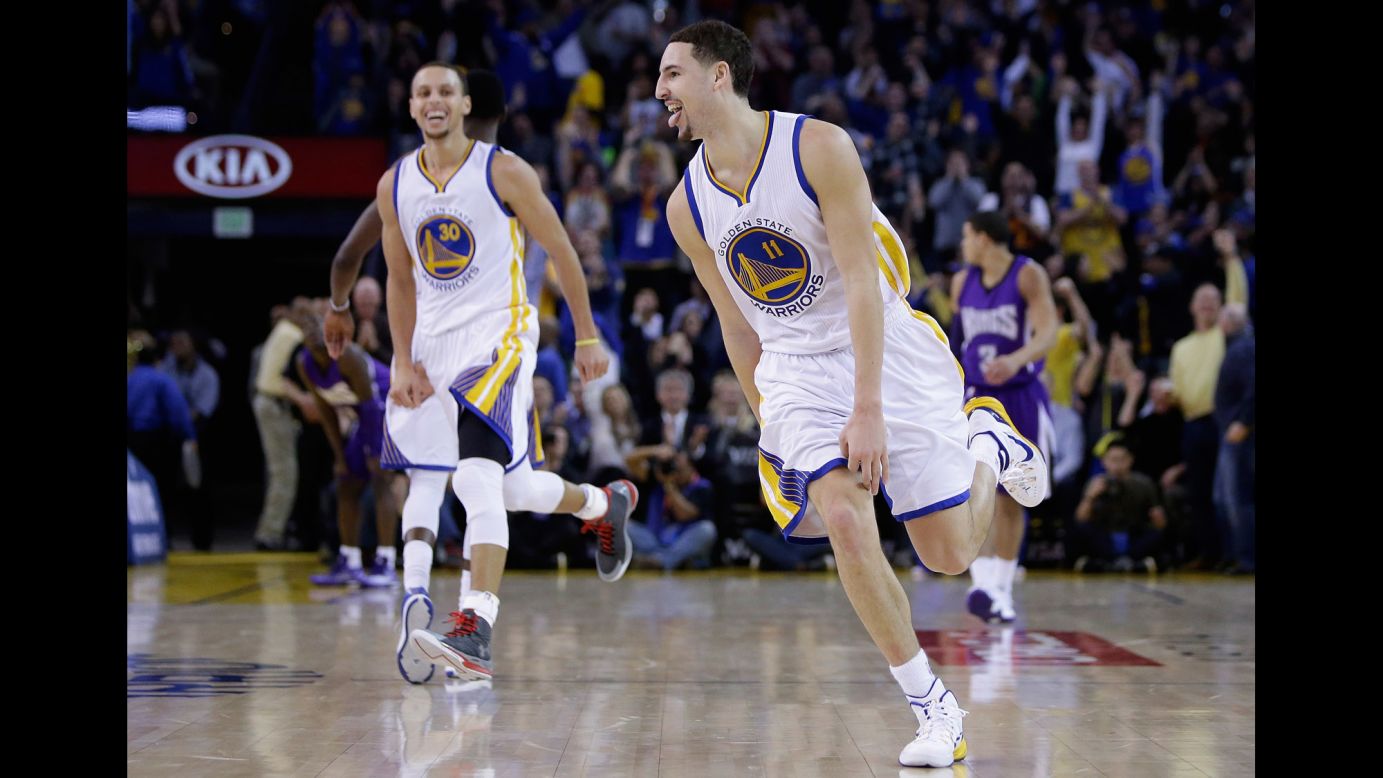 Klay Thompson of the Golden State Warriors sticks out his tongue after making a 3-pointer during a record-breaking third quarter Friday, January 23, in Oakland, California. Thompson scored an NBA-record 37 points in the quarter, making all 13 of the shots he took. Nine of them were 3-pointers. He finished the game with 52 points as Golden State smashed Sacramento 126-101.