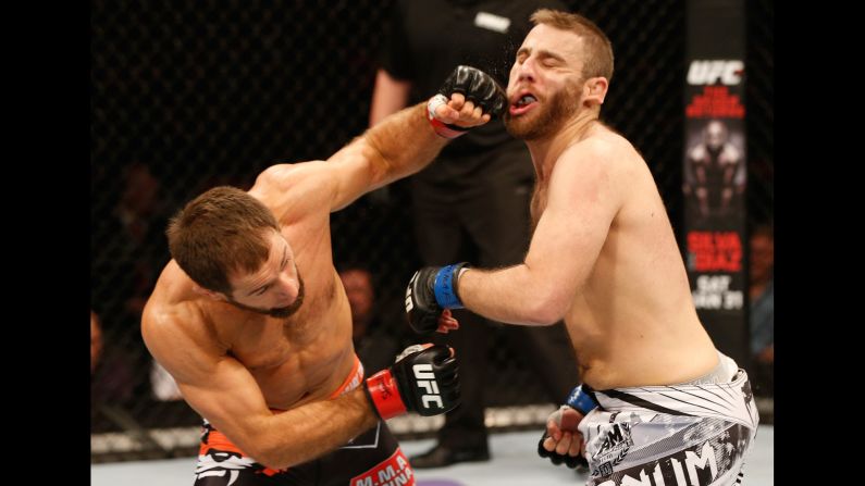 Mairbek Taisumov punches Anthony Christodoulou during a UFC event in Stockholm, Sweden, on Saturday, January 24. Taisumov won the lightweight bout by second-round knockout.