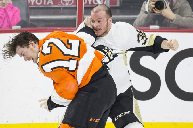 Pittsburgh's Zach Sill, right, fights Philadelphia's Michael Raffl during an NHL game in Philadelphia on Tuesday, January 20.