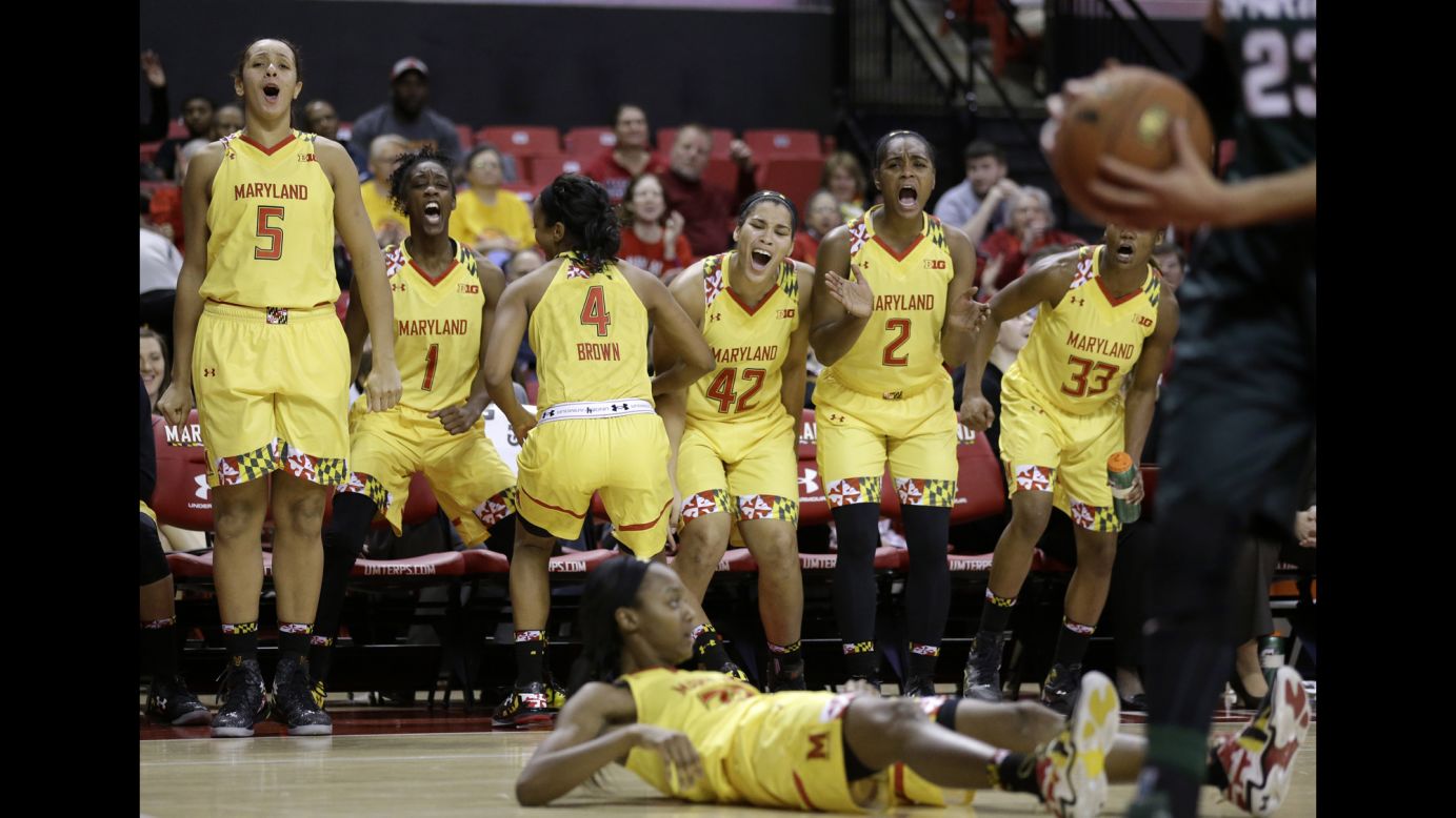 Maryland basketball players celebrate a shot made by Shatori Walker-Kimbrough, bottom, during a home game against Michigan State on Thursday, January 22.