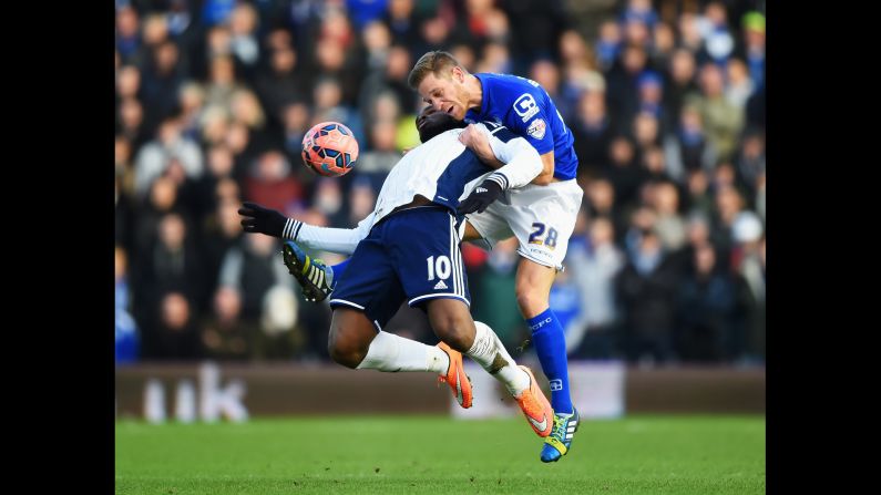Victor Anichebe of West Bromwich Albion, left, is challenged by Michael Morrison of Birmingham City during an FA Cup match in Birmingham, England, on Saturday, January 24. West Brom won the fourth-round match 2-1 thanks to two goals from Anichebe.