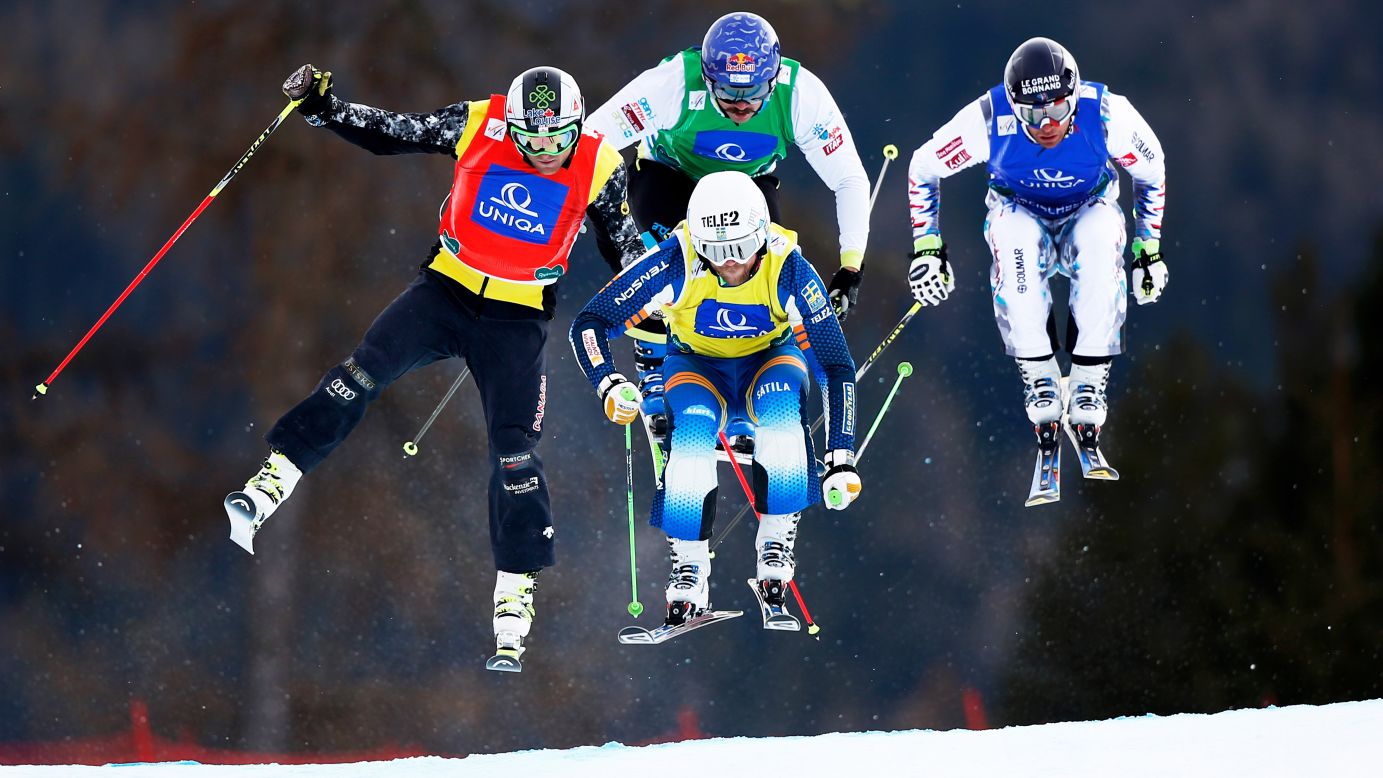 Clockwise from left, Brady Leman, Filip Flisar, Bastien Midol and Michael Forslund compete in a Men's Ski Cross race Sunday, January 25, at the Ski and Snowboard World Championships in Kreischberg, Austria. Flisar, from Slovenia, won gold in the event.