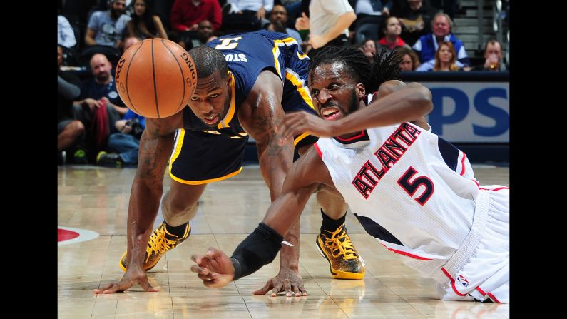 Atlanta's DeMarre Carroll battles Indiana's Rodney Stuckey for a loose ball during an NBA game in Atlanta on Wednesday, January 21.
