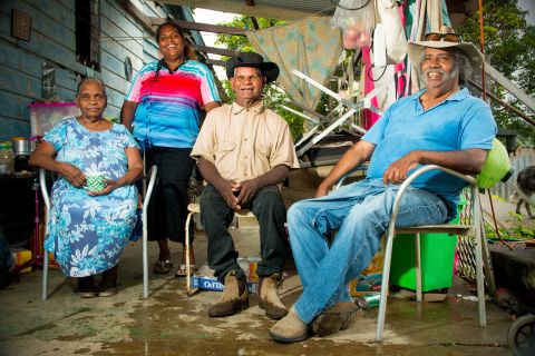 Kuku Yalanji elders sit with Lenice Schonenberger. They're working to protect and revitalize the local language for future generations. The Kuku Yalanji people are from the rainforest regions in Far North Queensland.