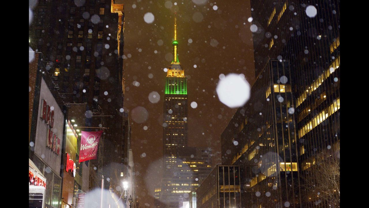 Snow falls around the Empire State Building in New York on January 26.