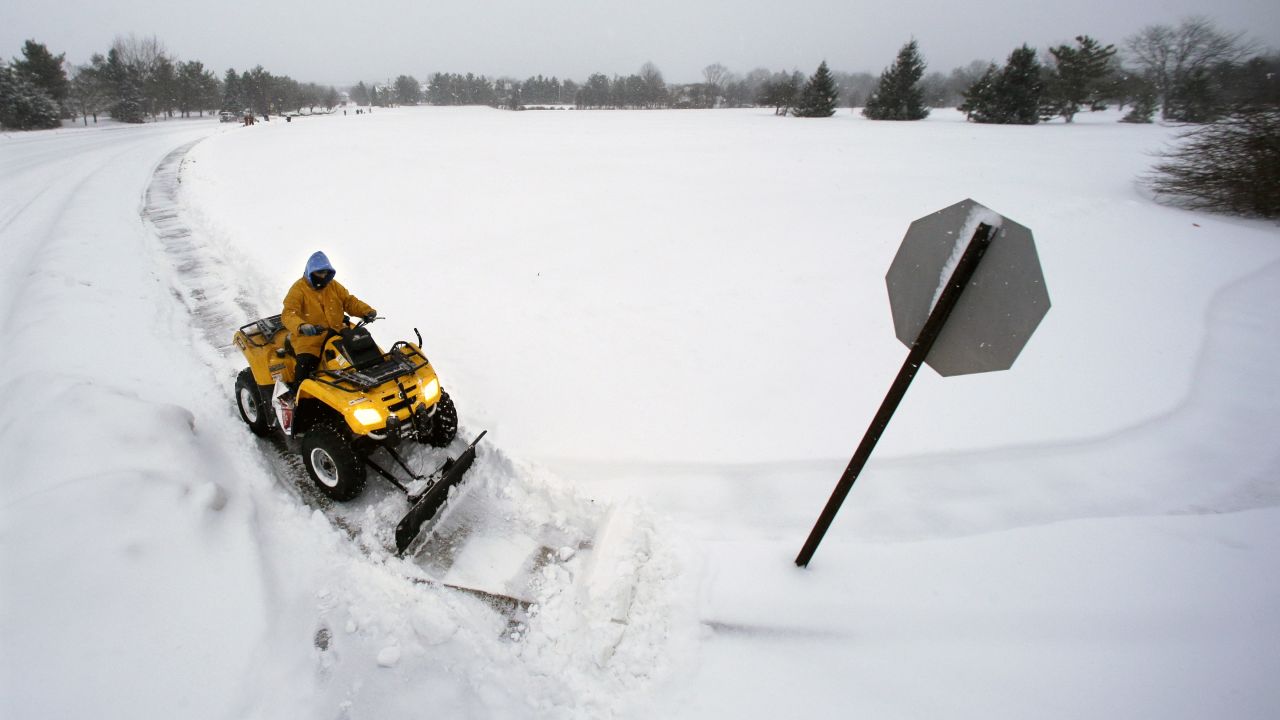 A worker clears snow in Newtown, Pennsylvania, on January 27.