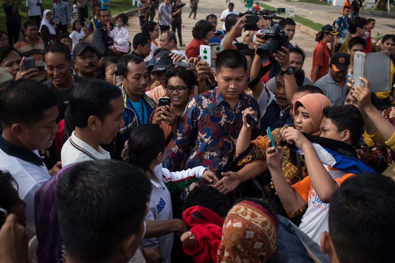 Near the riverbank, an elderly woman approached Jokowi.<br /><br />"She asked my number -- telephone number!"<br /><br />"Things are getting a little too friendly," Amanpour said with a smile.