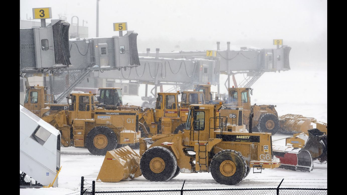 Plows line up at airplane gates at Bradley International Airport in Windsor Locks, Connecticut, on January 27.