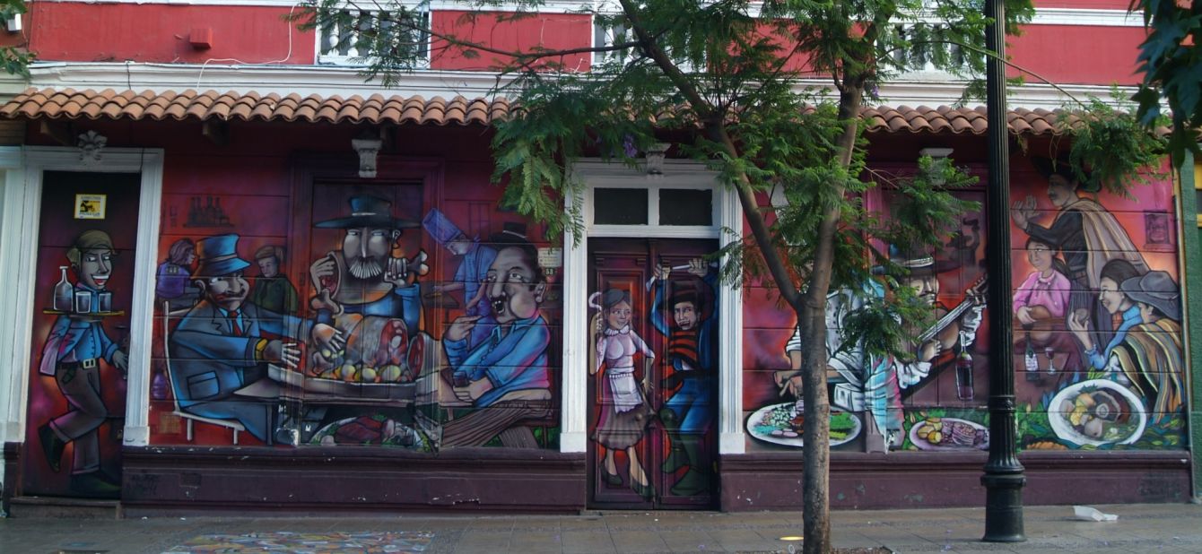 In Santiago, government councils and local businesses -- like this traditional restaurant -- are turning to graffiti artists to rejuvenate public spaces.