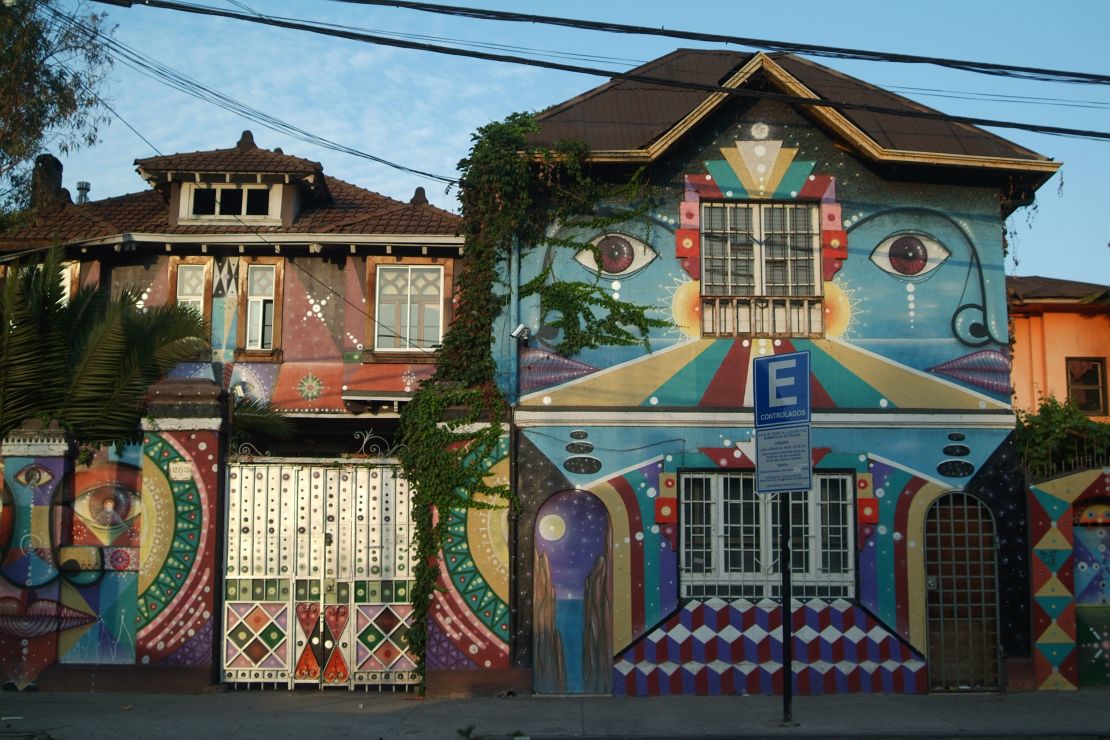 Colorful patterns cover the facade of La Chimba youth hostel in Barrio Bellavista, Santiago.