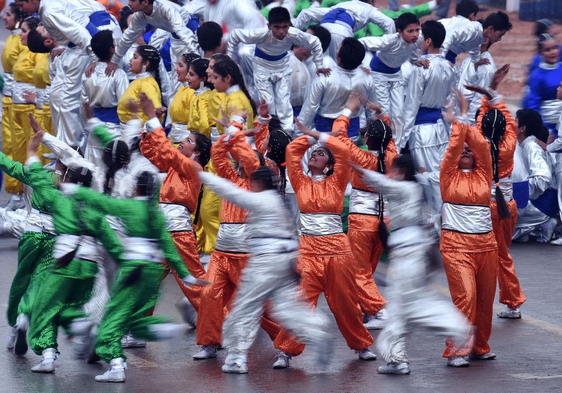 JANUARY 27 - NEW DELHI, INDIA: Dancers perform during India's Republic Day parade. Rain fails to dampen spirits as Barack Obama becomes the first U.S. President to attend the spectacular military and cultural display.