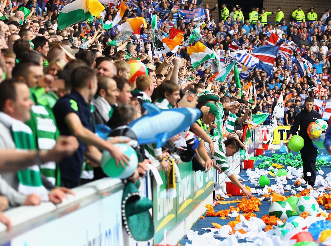 Celtic and Rangers fans show their support before an Old Firm game at Ibrox Stadium in 2011.