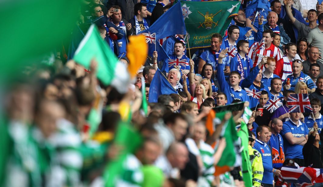 Fans of Celtic and Rangers taunt one another before an Old Firm fixture at Ibrox Stadium in 2011.