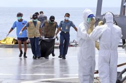 Searchers have so far retrieved 70 bodies from the Java Sea.