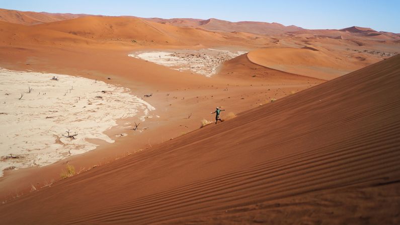Peering over the precipice of a 325-meter mountain of sand, only an idiot would try to run straight down.<br /><br />But despite the steepness of "Big Daddy," the king of Namibia's unearthly desert landscape, it's impossible to fall. <br /><br />Sand seeps into shoes, weighting runners upright as they rocket down.<br /><br />A minute later, the wind erases any trace of footprints.<br />
