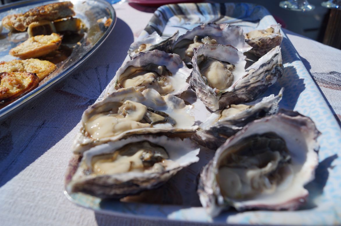 Just as wine tastes better in a vineyard, oysters are at their peak when scarfed meters away from the farms where they're raised.<br /><br />"Namibian oysters grow quick and especially plump," says Pieter Geyser, a skipper and guide with <a href="http://www.levotours.com/" target="_blank" target="_blank">Levo Tours</a> (<em>Corner of Union Street & 5th Road; +264 64 20 7555</em>).<br /><br />Salesmanship perhaps, but there's some truth to it.<br /><br />The delicious oysters in Namibia's Walvis Bay are fed by nutrient-rich waters brought up from Antarctica by an ocean current called the Benguela.<br /><br />They have a mildly salty and mineral taste and are best, according to Geyser, enjoyed with pepper, lime and Tabasco sauce.<br /><br />"It's the Namibian way," he says.<br /><br />Beyond the tours, the fresh oysters can be enjoyed on the Walvis Bay Waterfront.<br /><br />Try <a href="http://www.lagoonloge.com.na/pages/lyon-des-sables-restaurant/" target="_blank" target="_blank"><em>Lyon Des Sables</em></a><em>, 88 Kovambo Nujoma, Walvis Bay; +264 64 221 22</em><br />Or <a href="https://www.facebook.com/pages/Anchors-The-Jetty/126622544037029?sk=info&ref=page_internal" target="_blank" target="_blank"><em>Anchors at The Jetty</em></a><em>, Atlantic Street 1-3, Walvis Bay; +264 64 20 5762</em>