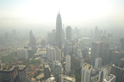 A haze has periodically wafted over Southeast Asia for 20 years. It is especially bad in the Asia-Pacific region, which has a population of over 4.2 billion and high population density. Pictured, smog hovers above the Kuala Lumpur skyline in June 2013. 