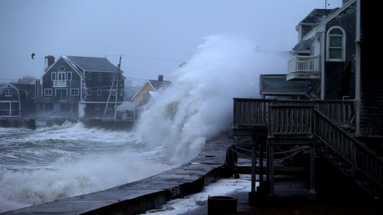 A wave slams into a sea wall in Scituate as evening high tide approaches on January 27.