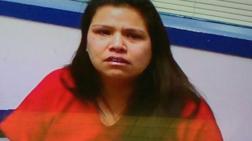 In this photo taken from a video monitor, Christina E. Booth is arraigned in Thurston County Superior Court in Olympia, Washington on Monday, Jan. 26, 2015. Booth, who is accused of stabbing her three small children, told detectives that she cut the children's throats with a kitchen knife to keep them quiet for her soldier husband.