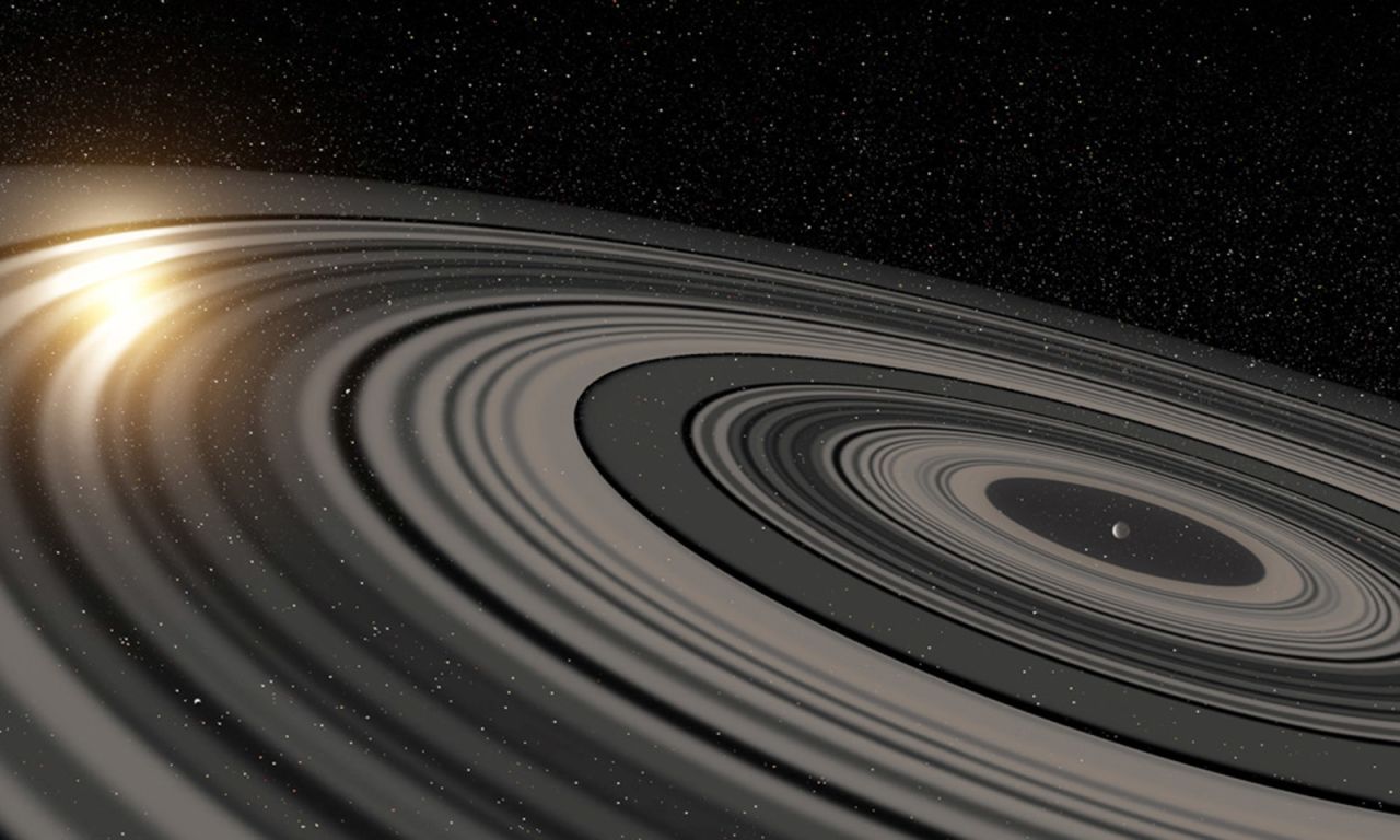 Using powerful optics, astronomers have found a planet-like body, J1407b, with rings 200 times the size of Saturn's. This is an artist's depiction of the rings of planet J1407b, which are eclipsing a star.