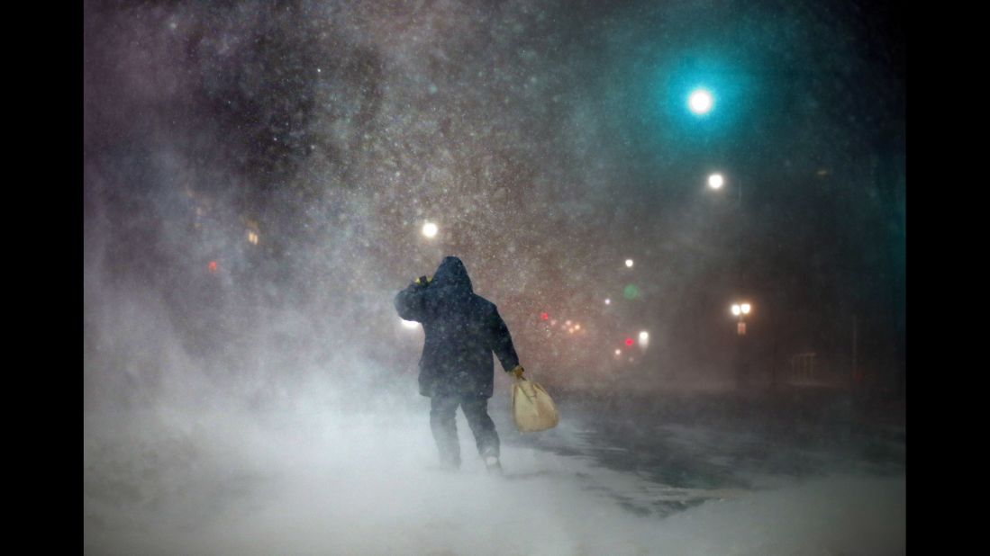 A man battles strong winds in Portland, Maine, on Tuesday, January 27.