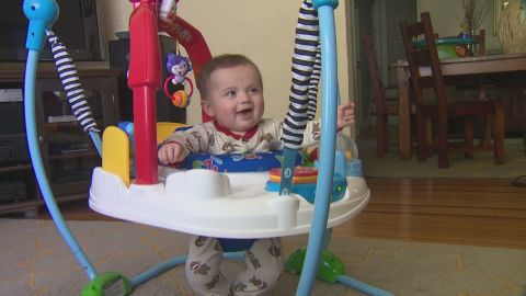 A happy baby, Livia Simon has been stuck at home because of possible exposure to an unvaccinated child.