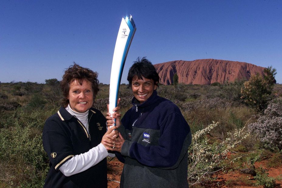 Goolagong Cawley, pictured in front of Uluru, is proud of her Aboriginal heritage.