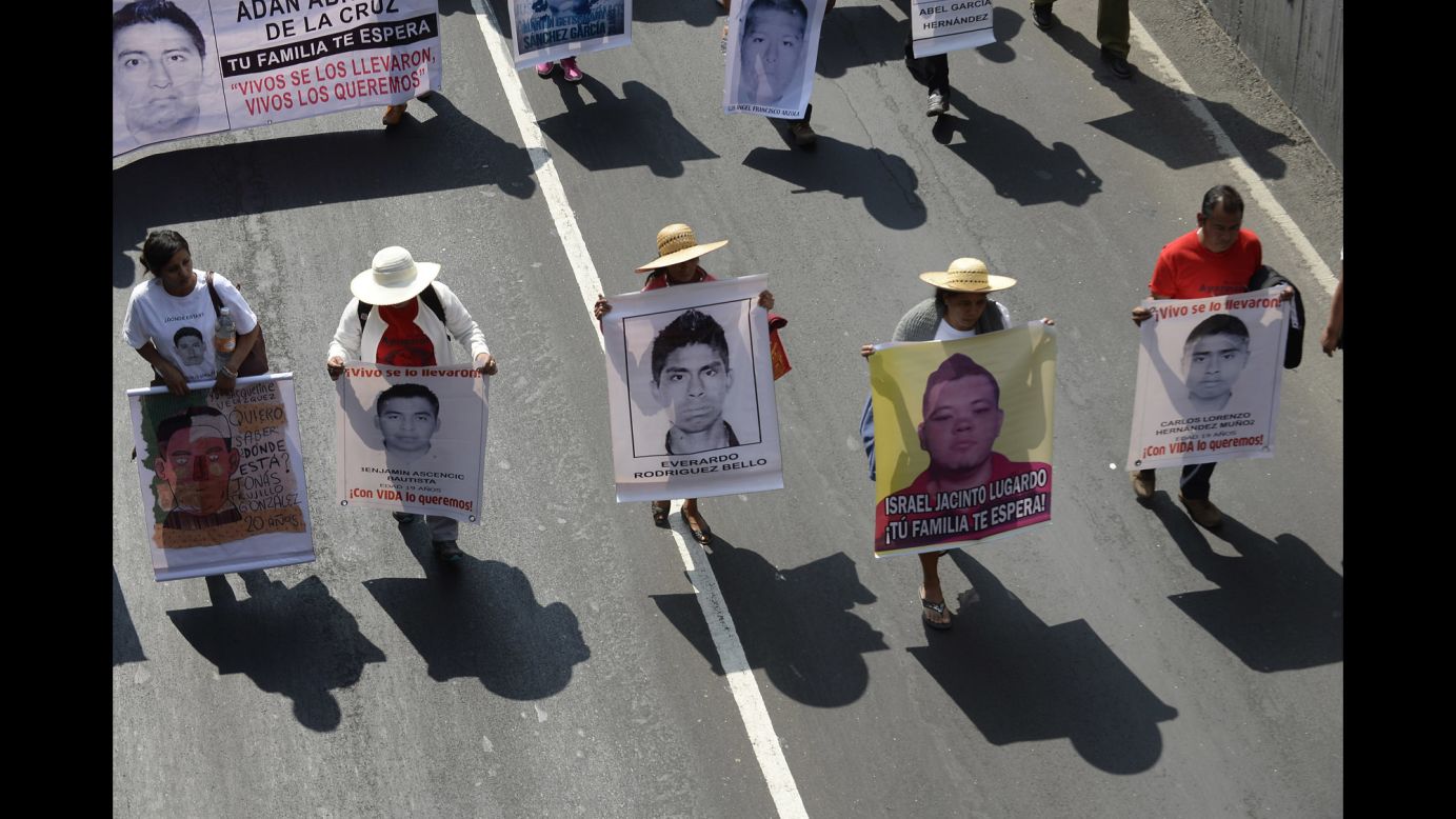 People march January 26 in Mexico City. The students attended Escuela Normal Rural de Ayotzinapa, a rural teachers college known for its political activism.