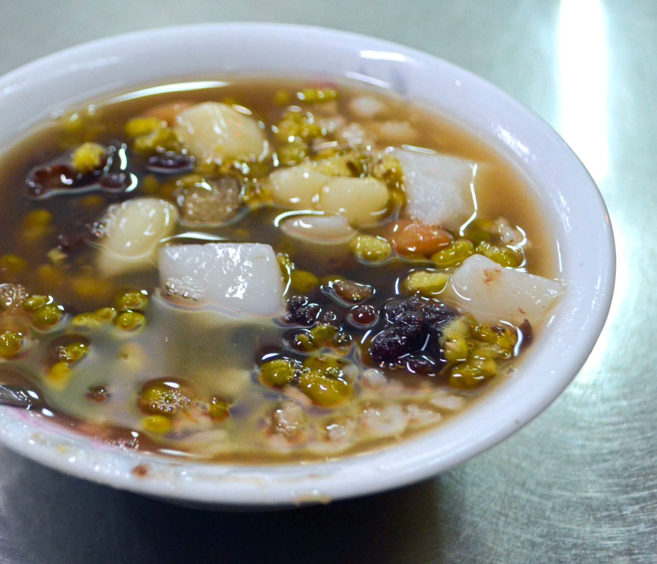 This dish is a trove for the eight "treasures," ingredients that include glutinous rice balls, peanuts and green and red beans. It's traditionally served with shaved ice in summer and soup in winter.