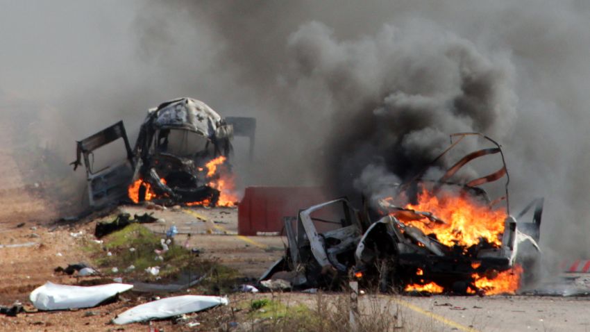 Israeli military vehicles are seen burning in the Shebaa farms an occupied area along the Israeli-Lebanese border near Ghajar village, on January 28, 2015