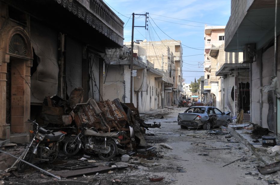 Collapsed buildings are seen in Kobani on January 27 after Kurdish forces took control of the town from ISIS.