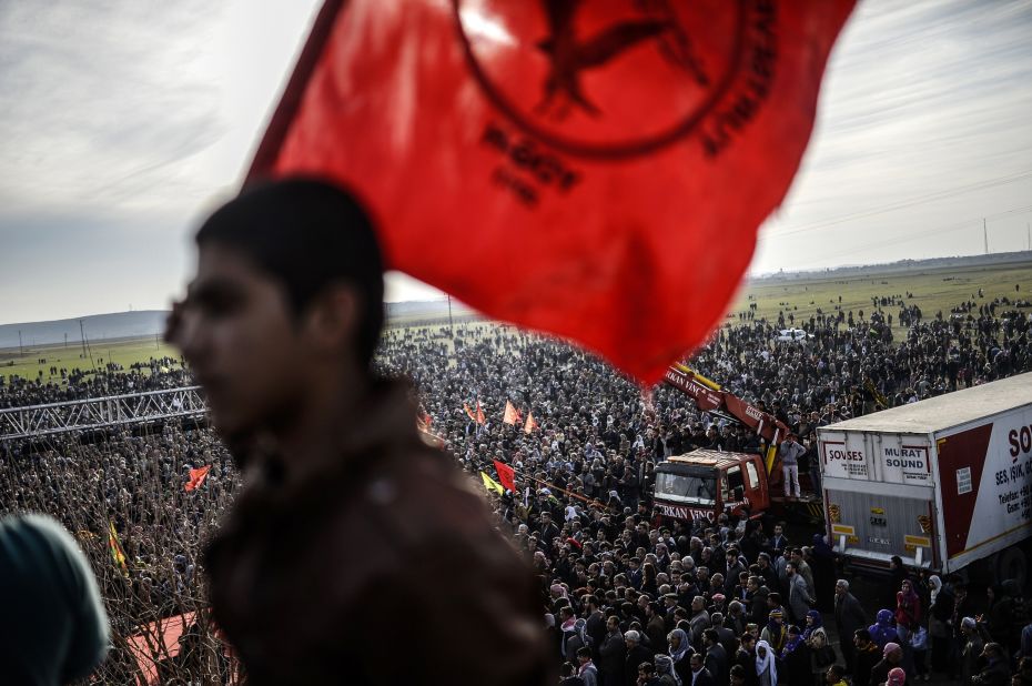 Kurdish people celebrate in Suruc, Turkey, near the Turkish-Syrian border, after ISIS militants were expelled from Kobani on Tuesday, January 27.