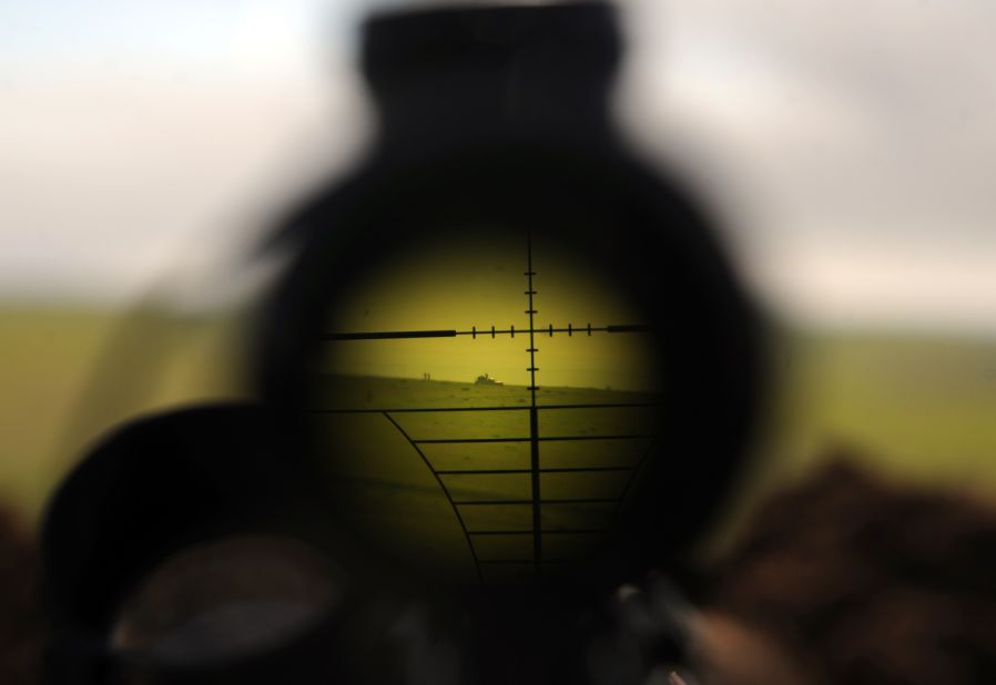 ISIS militants are seen through a rifle's scope during clashes with Peshmerga fighters in Mosul, Iraq, on Wednesday, January 21.