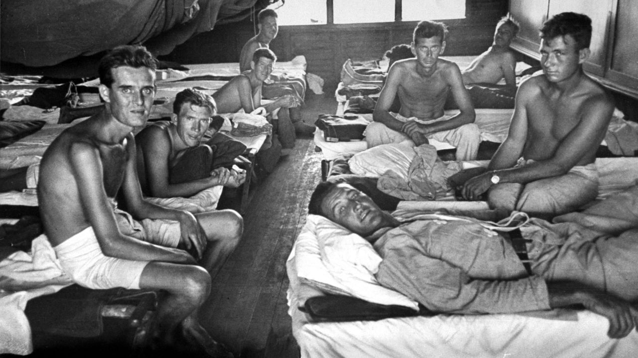 Allied POWs rescued from the Japanese prison camp receive medical treatment. 