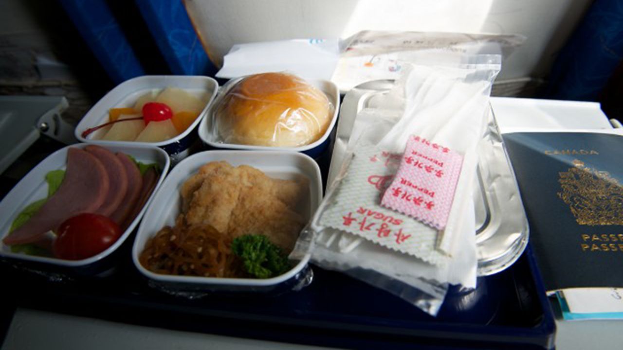 Air Koryo's in-flight meal service included cold chicken, warm potato curry, cold ham and a bun. For dessert: fruit salad.