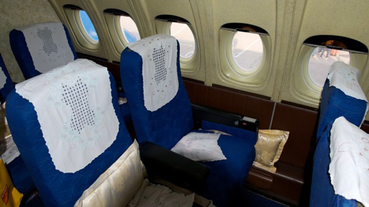If you were flying First Class on Air Koryo, your seat might look something like this -- with speckled, linoleum-like walls and tinted Bakelite window shades.