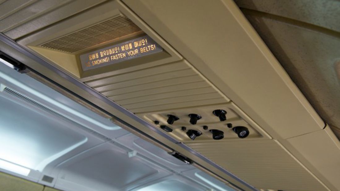 Overhead displays on Air Koryo's IL-62s are labeled in English as well as Korean. 