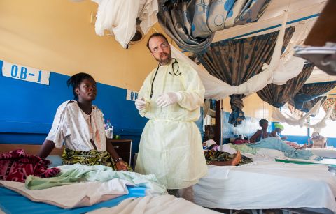 Dr. Richard Sacra cares for a patient at his clinic in Liberia. In August, Sacra was working as a missionary with <a href="http://www.sim.org/" target="_blank" target="_blank">SIM</a>, a family physician providing maternity care at <a href="http://www.elwaministries.com/elwa-hospital-2/" target="_blank" target="_blank">ELWA Hospital</a>. However, Ebola was never far away, and he unexpectedly became infected from a patient. His missionary organization <a href="http://www.cnn.com/video/data/2.0/video/health/2014/09/04/nd-gupta-sacra-ebola-diagnosis.cnn.html">flew him back to the United States </a>for treatment <a href="http://www.nebraskamed.com/biocontainment-unit/ebola" target="_blank" target="_blank">in Nebraska</a>. He fully recovered and <a href="http://www.simusa.org/content/latest-news/5123/dr_rick_sacra_ebola_survivor_returning_to_work_in_liberia" target="_blank" target="_blank">went back to Liberia</a> in January to help out. "I'm so grateful to all those who lent a caring, loving hand to me in my time of need," he said. "I have been deeply humbled by my Ebola experience. I'm grateful to God for allowing me to live, to continue to make a small difference in people's lives."