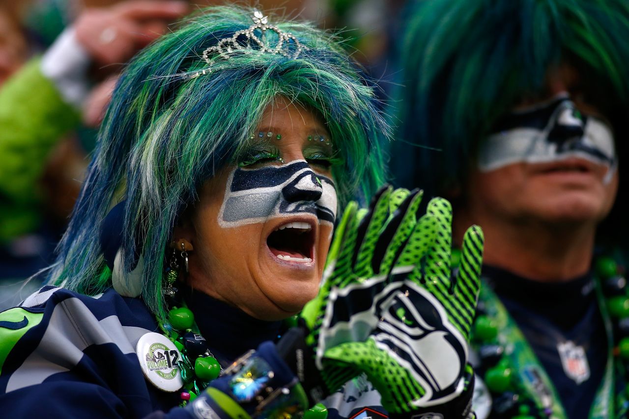 A Seattle Seahawks fan gets dressed up to support her team. The Seahawks are also the number one seed in their respective conference and are the first team to play in a consecutive Super Bowl event since 2005. 
