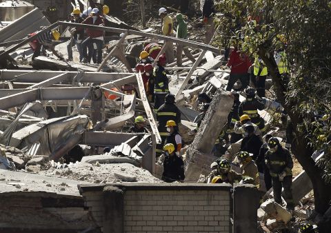 Rescue workers climb through the rubble left by the explosion. A truck was supplying gas to the hospital when apparently a hose burst and the resulting leak caused an explosion, Mexico City Mayor Miguel Angel Mancera said.  