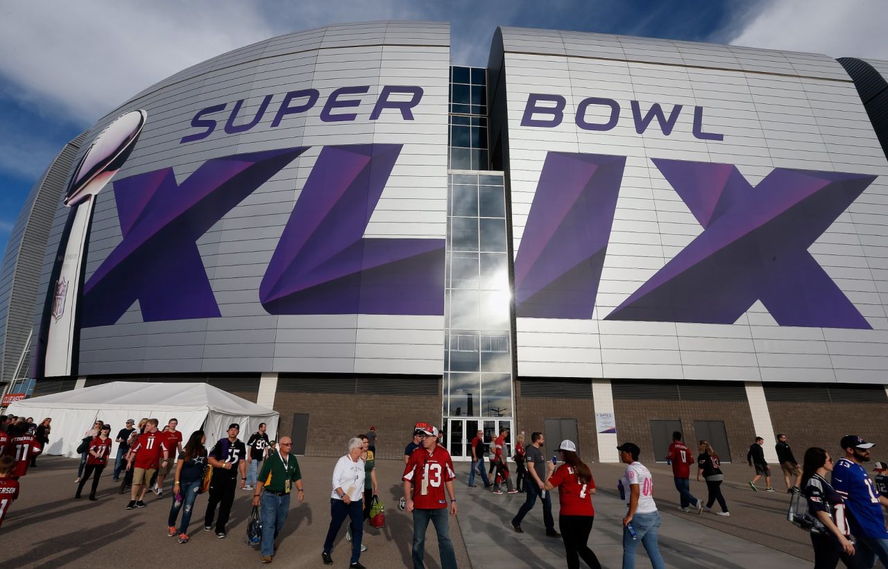 Fans outside the University of Phoenix stadium in Glendale, Arizona where Super Bowl XLIX will kick off. This is the second time the stadium has hosted the Super Bowl since 2008 when the New York Giants defeated the New England Patriots.