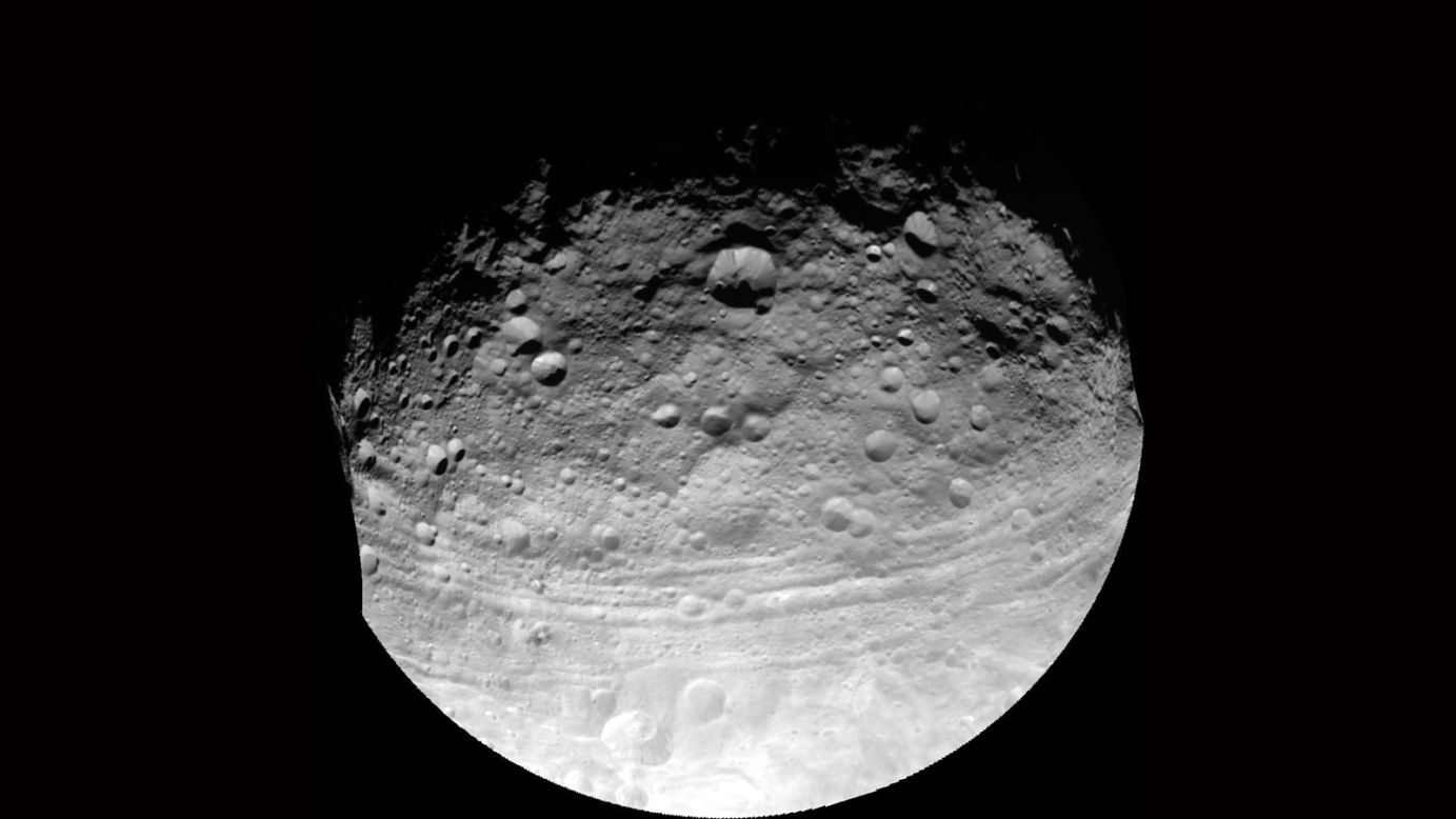 Journeying to the asteroid belt, a region located between Mars and Jupiter and populated with numerous misshapen bodies, Dawn was tasked first with studying the asteroid known as Vesta. Arriving in July 2011, Dawn spent 14 months orbiting the giant asteroid gathering data and imagery. Its findings indicated that Vesta is "<a href="http://mobile.nasa.gov/mission_pages/dawn/multimedia/vestaPerspective.html" target="_blank" target="_blank">the only intact layered planetary building block with an iron core known to be remaining since the early days of the solar system</a>." Due to its composition, it is actually more similar to terrestrial planets and the Earth's moon than other asteroids. Upon completion of this phase in July 2012, the probe began traveling toward Ceres, the first dwarf planet ever found and one of the largest objects in the asteroid belt.<br /><br />This full view of Vesta was taken by NASA's Dawn spacecraft, as part of a rotation characterization sequence, on July 24, 2011, at a distance of 3,200 miles (5,200 kilometers). The resolution of this image is about 500 meters per pixel.