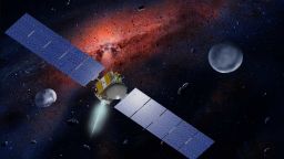 Artist concept showing the Dawn spacecraft with Ceres and Vesta. 