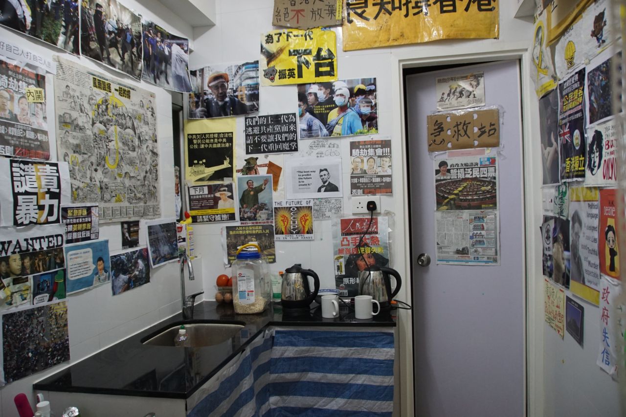 Newspaper clippings, posters and artwork from Hong Kong's three main protest sites wallpaper the kitchen of the Occupy Central Hotel.
