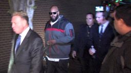 This image from video shows Death Row Records founder Marion "Suge" Knight, right, walking into the Los Angeles County Sheriffs department early Friday morning Jan. 30, 2015 in connection with a hit-and-run incident that left one man dead and another injured.