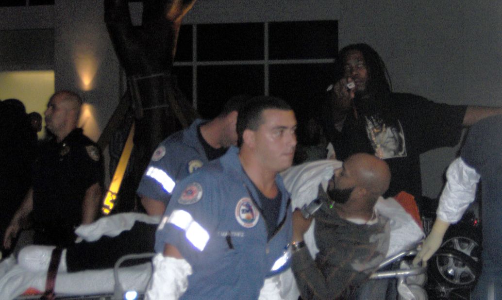 Knight is taken away by paramedics after he was shot in the leg at the Shore Club in Miami Beach, Florida, in August 2005.