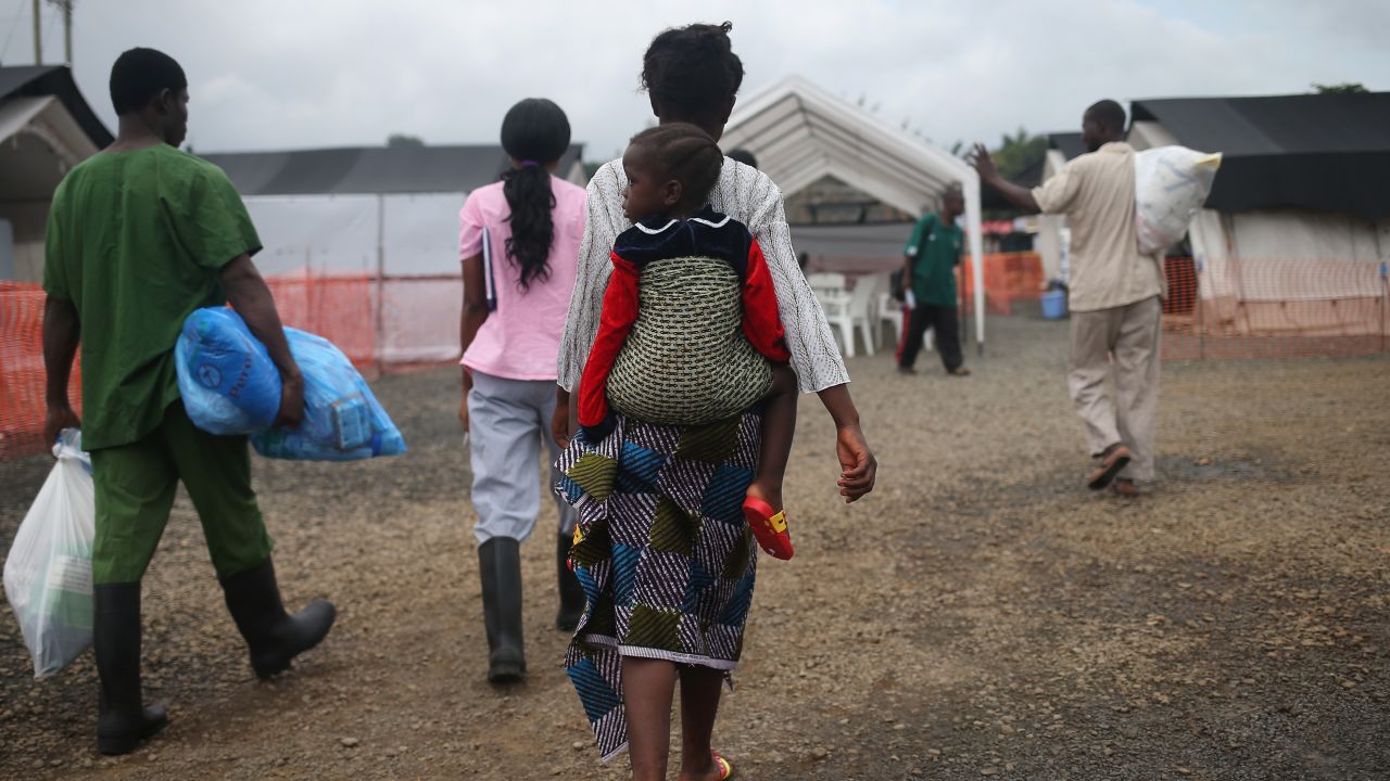 Ebola survivors leave a treatment center in Paynesville, Liberia, on October 12, 2014.