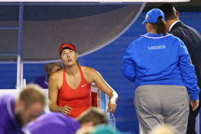 There was a 12-minute delay in the first set due to rain.