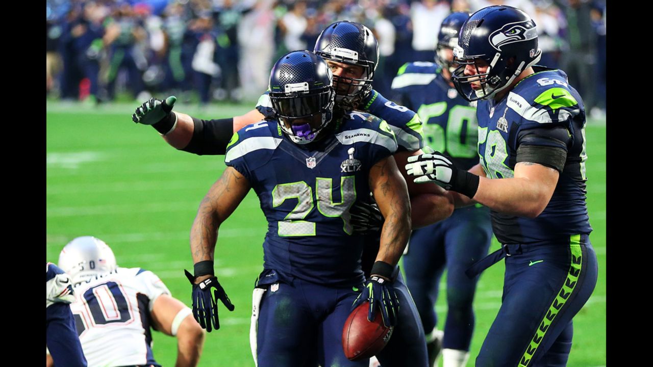 Seattle running back Marshawn Lynch (No. 24) reacts after scoring a second-quarter touchdown. The game was 7-7 after the extra point.