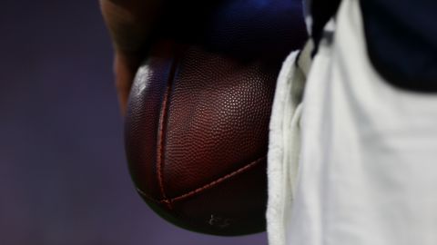 A closeup of a football during the game.
